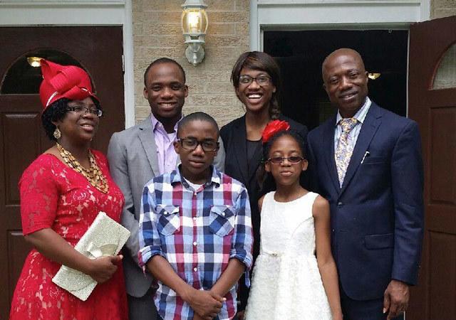 John Okperuvwe, right, with his wife Ufuoma and their children at church