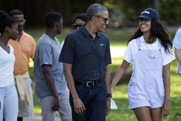 President Barack Obama walks with his daughter Malia Obama, right, on a visit to the Honolulu Zoo during a family vacation, on Saturday, Jan. 2, 2016, in Honolulu. (AP Photo/Evan Vucci)