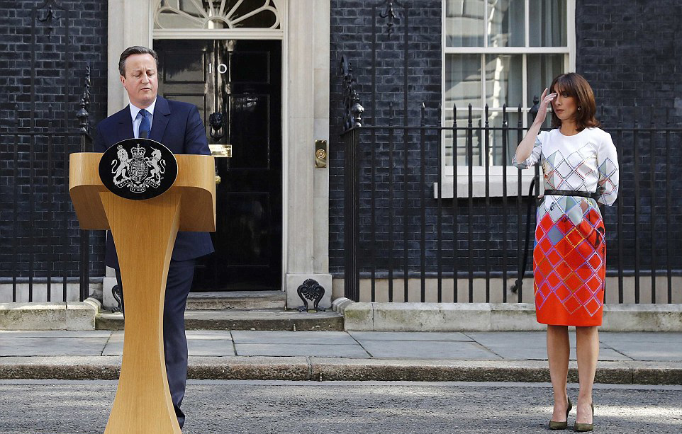 Cameron making his announcement this morning with his wife by his side at 10, Downing Street. (Photo: Reuters)
