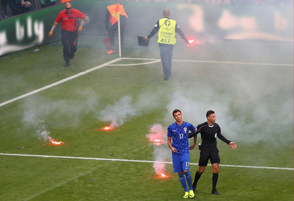 Mario Mandzukic and other Croatian players had to be removed from the pitch for safety concerns (Photo: Getty)